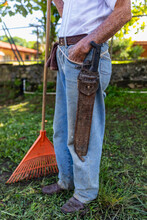 Farmer With Rake  In Costa Rica With Machete 