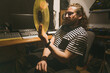 © Felipe Barrera/Stocksy - A man with a vinyl record in his hand