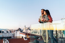 Happy Couple Hugging On Rooftop