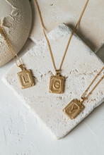 Gold Necklace On Stone Background