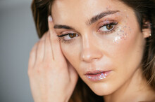 Young Woman Model With Glitter On Face