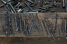 Drill Bits With Screws, Nails And Blacksmith Tools