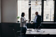 © Stereo Shot/Stocksy - Businesspeople during coffee break in conference room