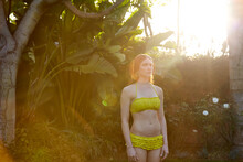 Portrait Of Woman In Swimsuit In Nature At Sunrise On Vacation 