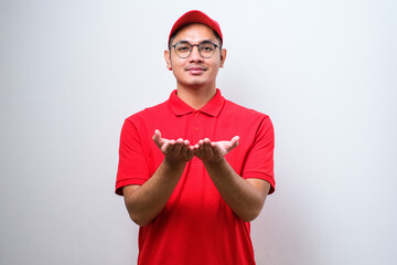 Delivery man showing something with empty opened hands