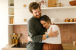 © STUDIO TAURUS/Stocksy - Smiling caucasian couple in love hugging