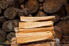 Logs Of Wood Cut For Firewood With The Background Of Other Logs