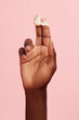 © Anna Tabakova/Stocksy - Hand showing cream product