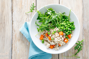 Sticker - Barley porridge with green peas, baked pumpkin and fresh arugula salad