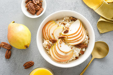 Canvas Print - Oatmeal with cottage cheese, pecan nuts and pear for breakfast