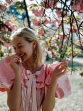 Girl In Pink Dress At Sakura Blossom Laughing