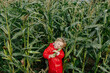 © Sergey Narevskih/Stocksy - Little kid hugging corn cob in field