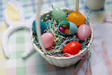 Closeup Of Plastic Eggs In Easter Basket With Spring Colors