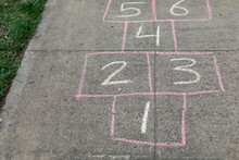Hopscotch Game Drawn On Sidewalk With Chalk