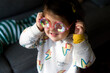 © Lauren Lee/Stocksy - Cute kid in funny glasses