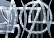 © Clive Watts/Stocksy - An abstract monochrome painting, white and grey on black.