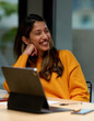 © Guille Faingold/Stocksy - Gleeful woman smiling during break