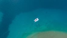 Overhead View Of A Man On The Pedal Boat In Azure Lagoon