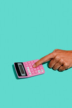 Man Using A Pink Electronic Calculator