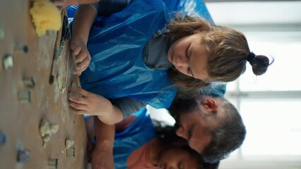 Wall Mural - Group of little kids with teacher working with pottery clay during creative art and craft class at school.