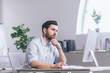 © Liubomir - Confident business man stocks broker sitting in front of monitor screen in office analyzing stat of index charts data analyses market trend. Forex trading agency worker agent reviewing profits growth