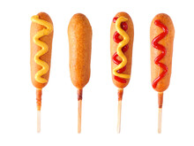 Four Corn Dogs With Different Toppings Isolated On A White Background