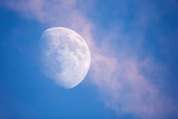 Wall Mural - big moon against the blue sky and a beautiful cloud.