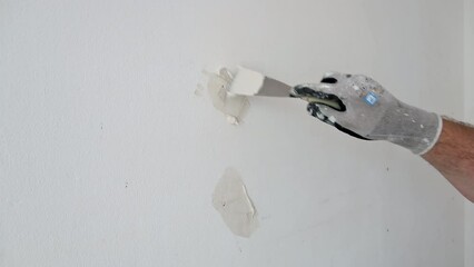 Wall Mural - Plasterer puttying holes in the wall