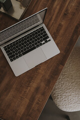 Wall Mural - Flatlay of laptop computer on solid wood table. View from above. Flat lay, top view