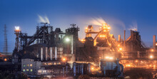 Azovstal In Mariupol, Ukraine Before War. Steel Plant At Night. Steel Factory With Smokestacks. Steel Works, Iron Works. Heavy Industry. Industrial Landscape With Metallurgical Combine, Smokes, Lights