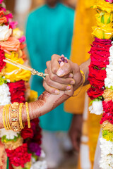 Indian Hindu married couple's holding hands close up