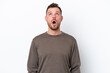 © luismolinero - Young Brazilian man isolated on white background looking up and with surprised expression
