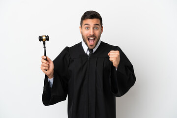 Canvas Print - Judge caucasian man isolated on white background celebrating a victory in winner position