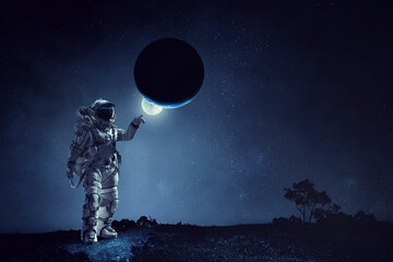 Wall Mural - astronaut walking on an unexplored planet