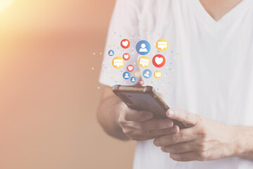 Wall Mural - Social media technology concept, man hand using smartphone Login to the online network Use social media to do business and marketing payment from home through the Internet.