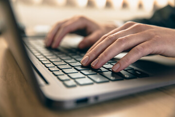 Wall Mural - woman hands working on a laptop computer