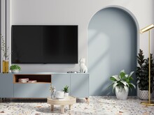 TV On Blue Cabinet In An Empty Living Room Interior With White Wall.