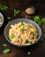 Wall Mural - Hawaiian pasta with ham, pineapple and creamy cheese.