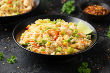 Prawn Fried Rice With Eggs And Vegetables In Black Bowl. Healthy Asian Food.