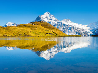 Wall Mural - high mountains and reflection on the surface of the lake. mountain valley with lake. landscape in th