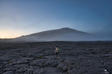 person on volcanic land