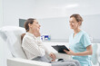 © Svitlana - Woman talking with doctor beautician in cosmetology clinic