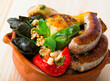 Kapama a dish of bulgarian cuisine with assortiment meat, grape rolls and stuffed pepper