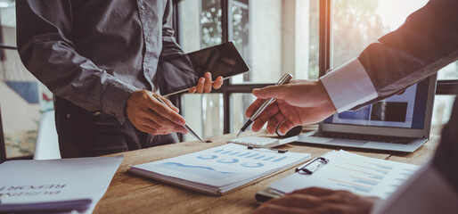 Wall Mural - Business People Meeting to analyse and discuss and brainstorming the financial report chart data in office, Financial advisor teamwork and accounting concept