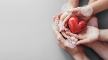 Adult And Children Hands Holding Red Heart With Family Health Insurance, Donation And Charity Icons Concept