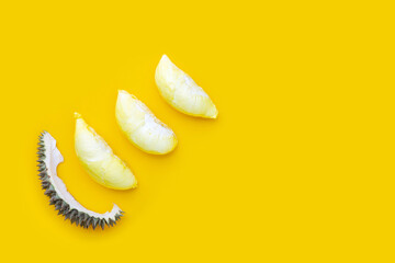 Wall Mural - Fresh ripe cut durian on yellow background.