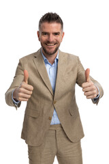 Wall Mural - middle aged businessman making thumbs up gesture and smiling