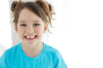 the kid lost a tooth. baby without a tooth. portrait of a little girl no tooth. high quality photo