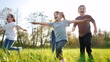 © ibragimova - group of children running in the park. happy family baby kid dream concept. kindergarten. children hands to the sides play pilots plane run on the lifestyle grass in the summer in the park