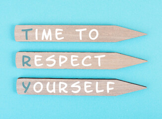 the words time to respect yourself are standing on wooden arrows, responsibility and development, mo